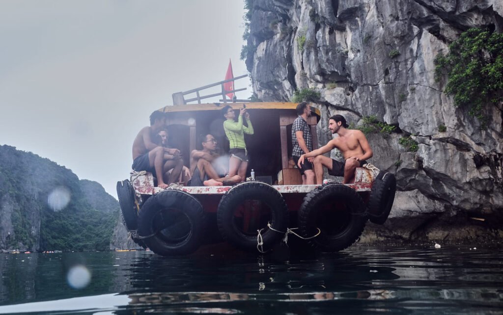 From the water looking out to the boat in Cat Ba island that would take us to the wall to climb the karst cliffs. Climbers sit on the front of the boat waiting fo their turn.