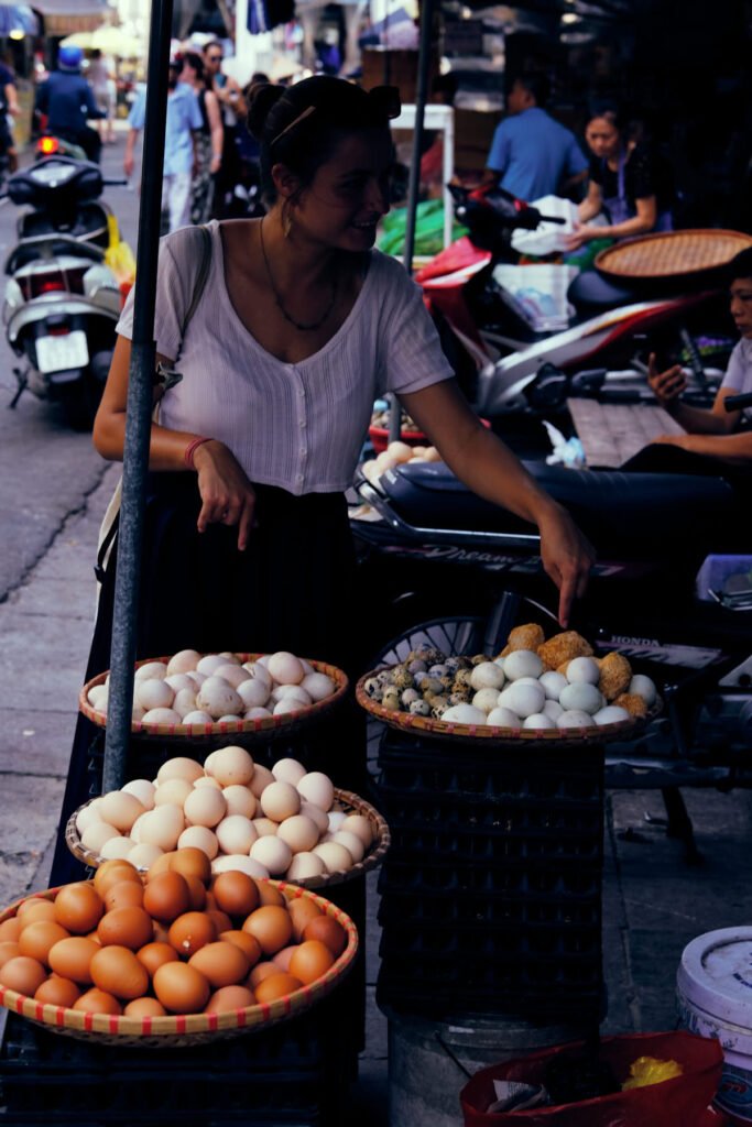 Large quantities of eggs sit in bowls in the market of Long Bien, Hanoi.