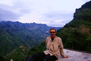 This is me sitting on top of a concrete block in front of the deepest canyons in all of SE Asia - Tu San Canyon.