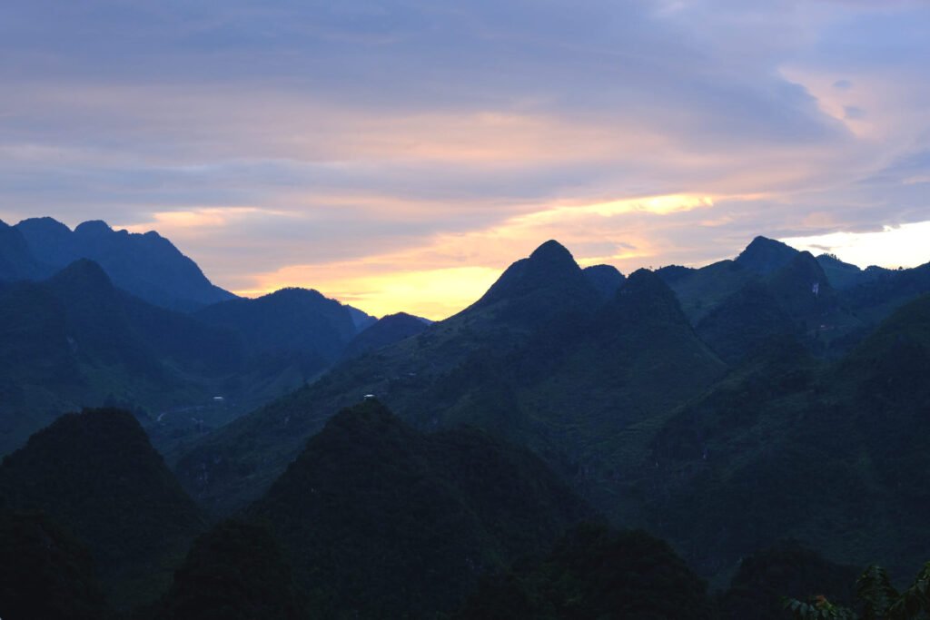 Thin cloud cover leaves just enough room for a fairy floss sunset to break through behind the ranges at Lung Ho viewpoint