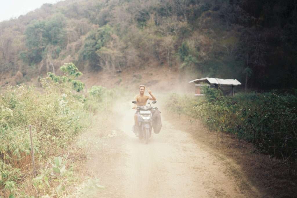 Riding through the bumpy and dusty farmlands coming back from the surf near Scar Reef, Sumbawa