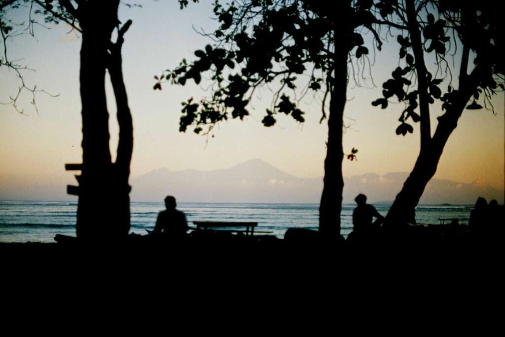 Sunset colours light up the sky at Jelenga, Sumbawa. Looking out in the distance you can see Mt. Rinjani in Lombok.